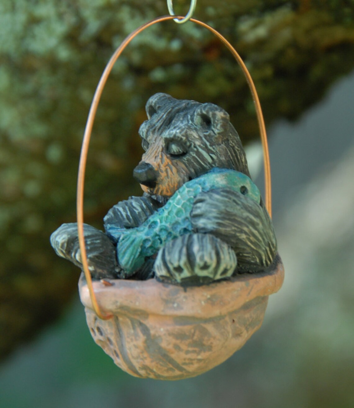 Sleeping black bear walnut ornament