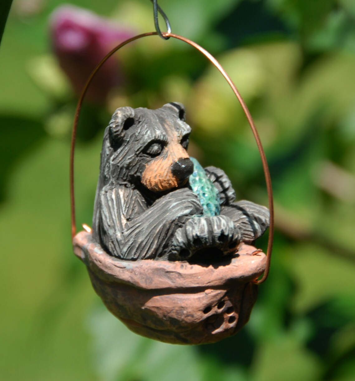 Sleeping black bear walnut ornament