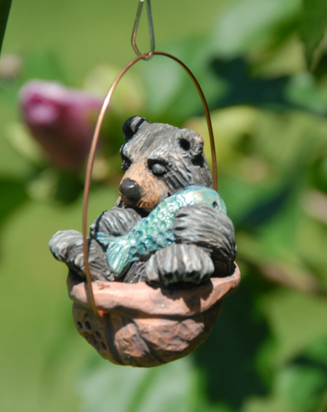 Sleeping black bear walnut ornament