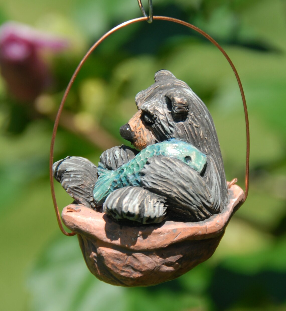 Sleeping black bear walnut ornament